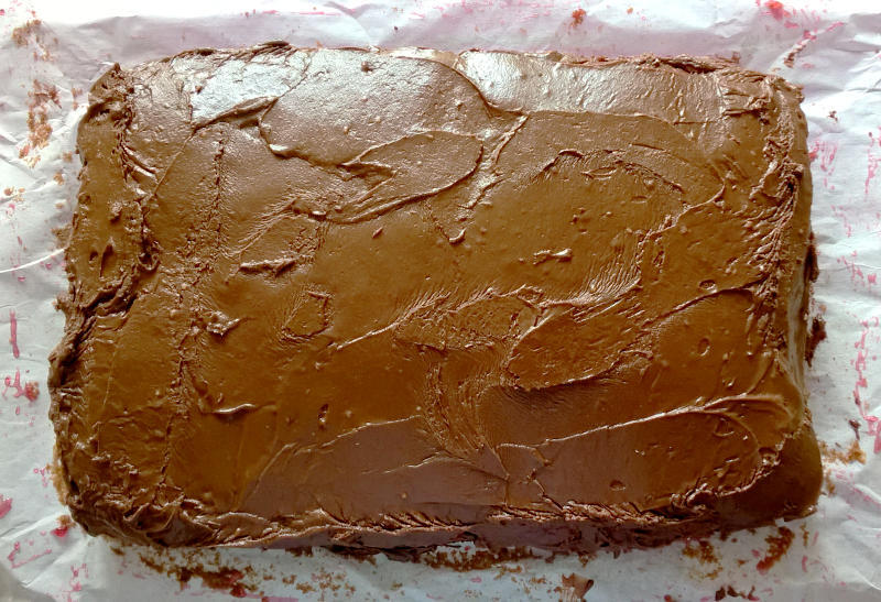 A chocolate cake, ready to be decorated